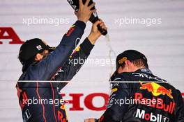 (L to R): Sergio Perez (MEX) Red Bull Racing celebrates with team mate and race winner Max Verstappen (NLD) Red Bull Racing. 09.10.2022. Formula 1 World Championship, Rd 18, Japanese Grand Prix, Suzuka, Japan, Race Day.