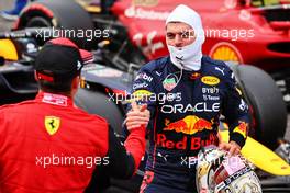 Max Verstappen (NLD) Red Bull Racing celebrates his pole position in qualifying parc ferme with second placed Charles Leclerc (MON) Ferrari. 08.10.2022. Formula 1 World Championship, Rd 18, Japanese Grand Prix, Suzuka, Japan, Qualifying Day.