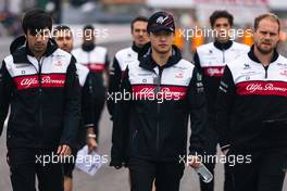 Guanyu Zhou (CHN) Alfa Romeo F1 Team walks the circuit with the team. 06.10.2022. Formula 1 World Championship, Rd 18, Japanese Grand Prix, Suzuka, Japan, Preparation Day.