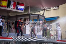 Race winner Sergio Perez (MEX) Red Bull Racing celebrates on the podium with Christian Horner (GBR) Red Bull Racing Team Principal and Max Verstappen (NLD) Red Bull Racing. 29.05.2022. Formula 1 World Championship, Rd 7, Monaco Grand Prix, Monte Carlo, Monaco, Race Day.