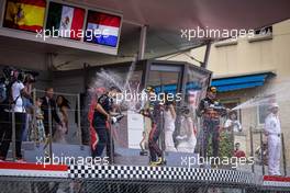 Race winner Sergio Perez (MEX) Red Bull Racing celebrates on the podium with Christian Horner (GBR) Red Bull Racing Team Principal. 29.05.2022. Formula 1 World Championship, Rd 7, Monaco Grand Prix, Monte Carlo, Monaco, Race Day.