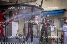 (L to R): Race winner Sergio Perez (MEX) Red Bull Racing celebrates on the podium with Max Verstappen (NLD) Red Bull Racing. 29.05.2022. Formula 1 World Championship, Rd 7, Monaco Grand Prix, Monte Carlo, Monaco, Race Day.