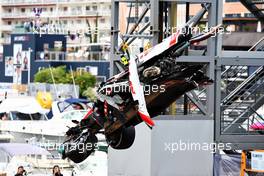 The damaged Haas VF-22 of Mick Schumacher (GER) Haas F1 Team is craned clear. 29.05.2022. Formula 1 World Championship, Rd 7, Monaco Grand Prix, Monte Carlo, Monaco, Race Day.