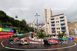 Carlos Sainz Jr (ESP) Ferrari F1-75 and Sergio Perez (MEX) Red Bull Racing RB18. 29.05.2022. Formula 1 World Championship, Rd 7, Monaco Grand Prix, Monte Carlo, Monaco, Race Day.