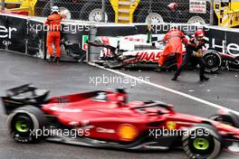 Charles Leclerc (MON) Ferrari F1-75 passed the crashed Haas VF-22 of Mick Schumacher (GER) Haas F1 Team. 29.05.2022. Formula 1 World Championship, Rd 7, Monaco Grand Prix, Monte Carlo, Monaco, Race Day.