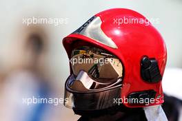 Lando Norris (GBR) McLaren MCL36 reflected in a fire marshal's helmet visor. 28.05.2022. Formula 1 World Championship, Rd 7, Monaco Grand Prix, Monte Carlo, Monaco, Qualifying Day.