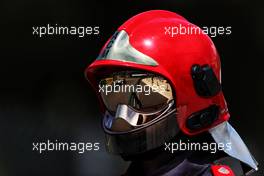 Yuki Tsunoda (JPN) AlphaTauri AT03 reflected in a fire marshal's helmet visor. 28.05.2022. Formula 1 World Championship, Rd 7, Monaco Grand Prix, Monte Carlo, Monaco, Qualifying Day.