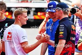 (L to R): Mick Schumacher (GER) Haas F1 Team with Esteban Ocon (FRA) Alpine F1 Team and Max Verstappen (NLD) Red Bull Racing on the drivers parade. 29.05.2022. Formula 1 World Championship, Rd 7, Monaco Grand Prix, Monte Carlo, Monaco, Race Day.