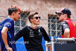 (L to R): Alexander Albon (THA) Williams Racing with George Russell (GBR) Mercedes AMG F1 and Pierre Gasly (FRA) AlphaTauri on the drivers parade. 29.05.2022. Formula 1 World Championship, Rd 7, Monaco Grand Prix, Monte Carlo, Monaco, Race Day.