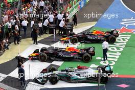 Lewis Hamilton (GBR) Mercedes AMG F1 W13; Max Verstappen (NLD) Red Bull Racing RB18; and Sergio Perez (MEX) Red Bull Racing RB18 in parc ferme. 30.10.2022. Formula 1 World Championship, Rd 20, Mexican Grand Prix, Mexico City, Mexico, Race Day.