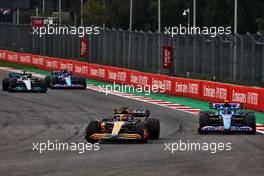 Daniel Ricciardo (AUS) McLaren MCL36 and Esteban Ocon (FRA) Alpine F1 Team A522 battle for position. 30.10.2022. Formula 1 World Championship, Rd 20, Mexican Grand Prix, Mexico City, Mexico, Race Day.