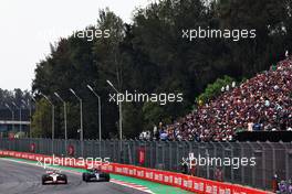 Mick Schumacher (GER) Haas VF-22 and Nicholas Latifi (CDN) Williams Racing FW44 battle for position. 30.10.2022. Formula 1 World Championship, Rd 20, Mexican Grand Prix, Mexico City, Mexico, Race Day.