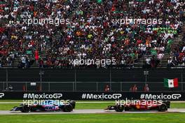 Fernando Alonso (ESP) Alpine F1 Team A522 and Carlos Sainz Jr (ESP) Ferrari F1-75. 30.10.2022. Formula 1 World Championship, Rd 20, Mexican Grand Prix, Mexico City, Mexico, Race Day.