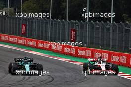 (L to R): Lance Stroll (CDN) Aston Martin F1 Team AMR22 and Kevin Magnussen (DEN) Haas VF-22 battle for position. 30.10.2022. Formula 1 World Championship, Rd 20, Mexican Grand Prix, Mexico City, Mexico, Race Day.