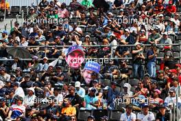 Circuit atmosphere - fans in the grandstand with Fernando Alonso (ESP) Alpine F1 Team and Sergio Perez (MEX) Red Bull Racing 'big heads'. 29.10.2022. Formula 1 World Championship, Rd 20, Mexican Grand Prix, Mexico City, Mexico, Qualifying Day.