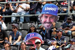 Circuit atmosphere - fans in the grandstand with a Fernando Alonso (ESP) Alpine F1 Team 'big head'. 29.10.2022. Formula 1 World Championship, Rd 20, Mexican Grand Prix, Mexico City, Mexico, Qualifying Day.