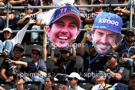 Circuit atmosphere - fans in the grandstand with Sergio Perez (MEX) Red Bull Racing and Fernando Alonso (ESP) Alpine F1 Team 'big heads'. 29.10.2022. Formula 1 World Championship, Rd 20, Mexican Grand Prix, Mexico City, Mexico, Qualifying Day.