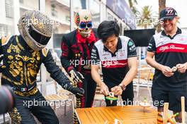 (L to R): Mario Achi (MEX) with a Day of the Dead Skeleton; Guanyu Zhou (CHN) Alfa Romeo F1 Team; and Valtteri Bottas (FIN) Alfa Romeo F1 Team. 27.10.2022. Formula 1 World Championship, Rd 20, Mexican Grand Prix, Mexico City, Mexico, Preparation Day.