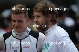 (L to R): Mick Schumacher (GER) Haas F1 Team with Sebastian Vettel (GER) Aston Martin F1 Team on the grid. 08.05.2022. Formula 1 World Championship, Rd 5, Miami Grand Prix, Miami, Florida, USA, Race Day.