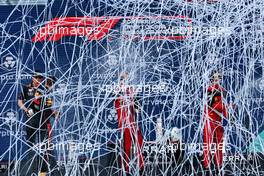 (L to R): Race winner Max Verstappen (NLD) Red Bull Racing; Charles Leclerc (MON) Ferrari; and Carlos Sainz Jr (ESP) Ferrari, celebrate on the podium. 08.05.2022. Formula 1 World Championship, Rd 5, Miami Grand Prix, Miami, Florida, USA, Race Day.