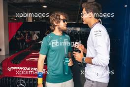 (L to R): Sebastian Vettel (GER) Aston Martin F1 Team with George Russell (GBR) Mercedes AMG F1 on the drivers parade. 08.05.2022. Formula 1 World Championship, Rd 5, Miami Grand Prix, Miami, Florida, USA, Race Day.
