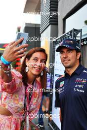 Sergio Perez (MEX) Red Bull Racing with a fan. 02.09.2022. Formula 1 World Championship, Rd 14, Dutch Grand Prix, Zandvoort, Netherlands, Practice Day.