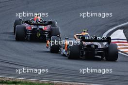 Sergio Perez (MEX) Red Bull Racing RB18 leads Lando Norris (GBR) McLaren MCL36. 04.09.2022. Formula 1 World Championship, Rd 14, Dutch Grand Prix, Zandvoort, Netherlands, Race Day.