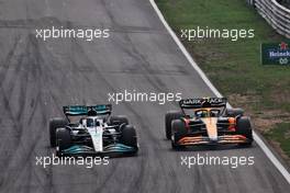 George Russell (GBR) Mercedes AMG F1 W13 and Lando Norris (GBR) McLaren MCL36 battle for position. 04.09.2022. Formula 1 World Championship, Rd 14, Dutch Grand Prix, Zandvoort, Netherlands, Race Day.