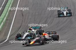 Lewis Hamilton (GBR) Mercedes AMG F1 W13 and Max Verstappen (NLD) Red Bull Racing RB18 battle for position. 04.09.2022. Formula 1 World Championship, Rd 14, Dutch Grand Prix, Zandvoort, Netherlands, Race Day.