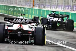 Yuki Tsunoda (JPN) AlphaTauri AT03 and Kevin Magnussen (DEN) Haas VF-22. 25.03.2022 Formula 1 World Championship, Rd 2, Saudi Arabian Grand Prix, Jeddah, Saudi Arabia, Practice Day.