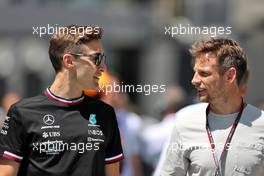 (L to R): George Russell (GBR) Mercedes AMG F1 with Jenson Button (GBR) Sky Sports F1 Presenter / Williams Racing Senior Advisor. 25.03.2022 Formula 1 World Championship, Rd 2, Saudi Arabian Grand Prix, Jeddah, Saudi Arabia, Practice Day.