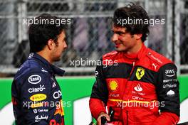 (L to R): Pole sitter Sergio Perez (MEX) Red Bull Racing with Carlos Sainz Jr (ESP) Ferrari in qualifying parc ferme. 26.03.2022. Formula 1 World Championship, Rd 2, Saudi Arabian Grand Prix, Jeddah, Saudi Arabia, Qualifying Day.
