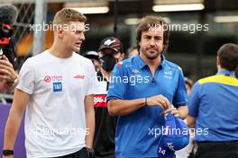 (L to R): Mick Schumacher (GER) Haas F1 Team and Fernando Alonso (ESP) Alpine F1 Team on the drivers parade. 27.03.2022. Formula 1 World Championship, Rd 2, Saudi Arabian Grand Prix, Jeddah, Saudi Arabia, Race Day.