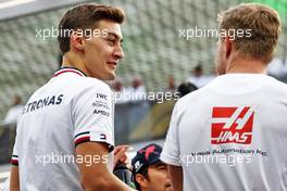(L to R): George Russell (GBR) Mercedes AMG F1 and Kevin Magnussen (DEN) Haas F1 Team on the drivers parade. 27.03.2022. Formula 1 World Championship, Rd 2, Saudi Arabian Grand Prix, Jeddah, Saudi Arabia, Race Day.