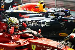 2nd place Charles Leclerc (MON) Ferrari F1-75 with 1st place Sergio Perez (MEX) Red Bull Racing RB18. 02.10.2022. Formula 1 World Championship, Rd 17, Singapore Grand Prix, Marina Bay Street Circuit, Singapore, Race Day.