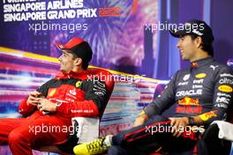(L to R): Charles Leclerc (MON) Ferrari and Sergio Perez (MEX) Red Bull Racing in the post race FIA Press Conference. 02.10.2022. Formula 1 World Championship, Rd 17, Singapore Grand Prix, Marina Bay Street Circuit, Singapore, Race Day.