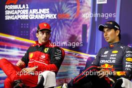 (L to R): Charles Leclerc (MON) Ferrari and Sergio Perez (MEX) Red Bull Racing in the post race FIA Press Conference. 02.10.2022. Formula 1 World Championship, Rd 17, Singapore Grand Prix, Marina Bay Street Circuit, Singapore, Race Day.
