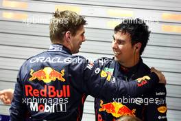 Max Verstappen (NLD) Red Bull Racing RB18 with 1st place Sergio Perez (MEX) Red Bull Racing RB18. 02.10.2022. Formula 1 World Championship, Rd 17, Singapore Grand Prix, Marina Bay Street Circuit, Singapore, Race Day.