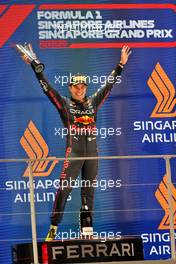 Race winner Sergio Perez (MEX) Red Bull Racing celebrates on the podium. 02.10.2022. Formula 1 World Championship, Rd 17, Singapore Grand Prix, Marina Bay Street Circuit, Singapore, Race Day.