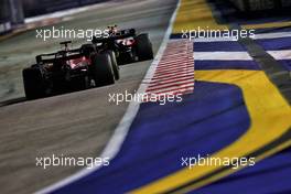 Sergio Perez (MEX) Red Bull Racing RB18 leads Charles Leclerc (MON) Ferrari F1-75. 02.10.2022. Formula 1 World Championship, Rd 17, Singapore Grand Prix, Marina Bay Street Circuit, Singapore, Race Day.