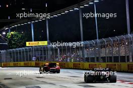 Sergio Perez (MEX) Red Bull Racing RB18 leads behind the Mercedes AMG FIA Safety Car. 02.10.2022. Formula 1 World Championship, Rd 17, Singapore Grand Prix, Marina Bay Street Circuit, Singapore, Race Day.