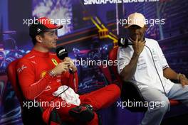 (L to R): Charles Leclerc (MON) Ferrari and Lewis Hamilton (GBR) Mercedes AMG F1 in the post qualifying FIA Press Conference. 01.10.2022. Formula 1 World Championship, Rd 17, Singapore Grand Prix, Marina Bay Street Circuit, Singapore, Qualifying Day.