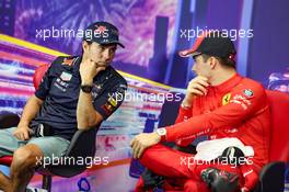 (L to R): Sergio Perez (MEX) Red Bull Racing and Charles Leclerc (MON) Ferrari in the post qualifying FIA Press Conference. 01.10.2022. Formula 1 World Championship, Rd 17, Singapore Grand Prix, Marina Bay Street Circuit, Singapore, Qualifying Day.