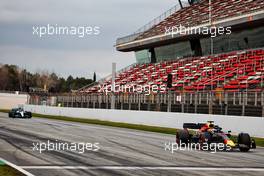 Sergio Perez (MEX) Red Bull Racing RB18 and Lewis Hamilton (GBR) Mercedes AMG F1 W13. 25.02.2022. Formula One Testing, Day Three, Barcelona, Spain. Friday.