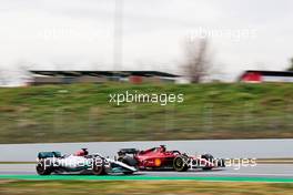 George Russell (GBR) Mercedes AMG F1 W13 and Charles Leclerc (MON) Ferrari F1-75. 25.02.2022. Formula One Testing, Day Three, Barcelona, Spain. Friday.