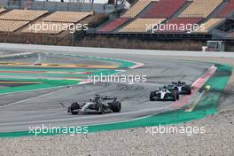 Guanyu Zhou (CHN) Alfa Romeo F1 Team C42 leads George Russell (GBR) Mercedes AMG F1 W13 and Alexander Albon (THA) Williams Racing FW44. 25.02.2022. Formula One Testing, Day Three, Barcelona, Spain. Friday.