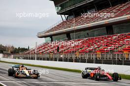 Daniel Ricciardo (AUS) McLaren MCL36 and Carlos Sainz Jr (ESP) Ferrari F1-75. 25.02.2022. Formula One Testing, Day Three, Barcelona, Spain. Friday.