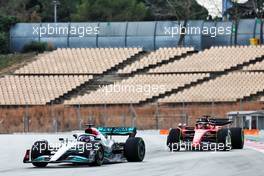 Lewis Hamilton (GBR) Mercedes AMG F1 W13 leads Carlos Sainz Jr (ESP) Ferrari F1-75. 25.02.2022. Formula One Testing, Day Three, Barcelona, Spain. Friday.