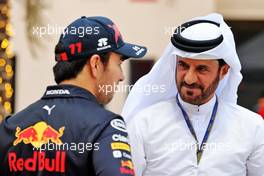 Sergio Perez (MEX) Red Bull Racing with Mohammed Bin Sulayem (UAE) FIA President. 11.03.2022. Formula 1 Testing, Sakhir, Bahrain, Day Two.