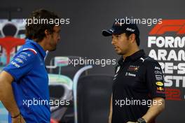 (L to R): Fernando Alonso (ESP) Alpine F1 Team with Sergio Perez (MEX) Red Bull Racing in the FIA Press Conference. 11.03.2022. Formula 1 Testing, Sakhir, Bahrain, Day Two.